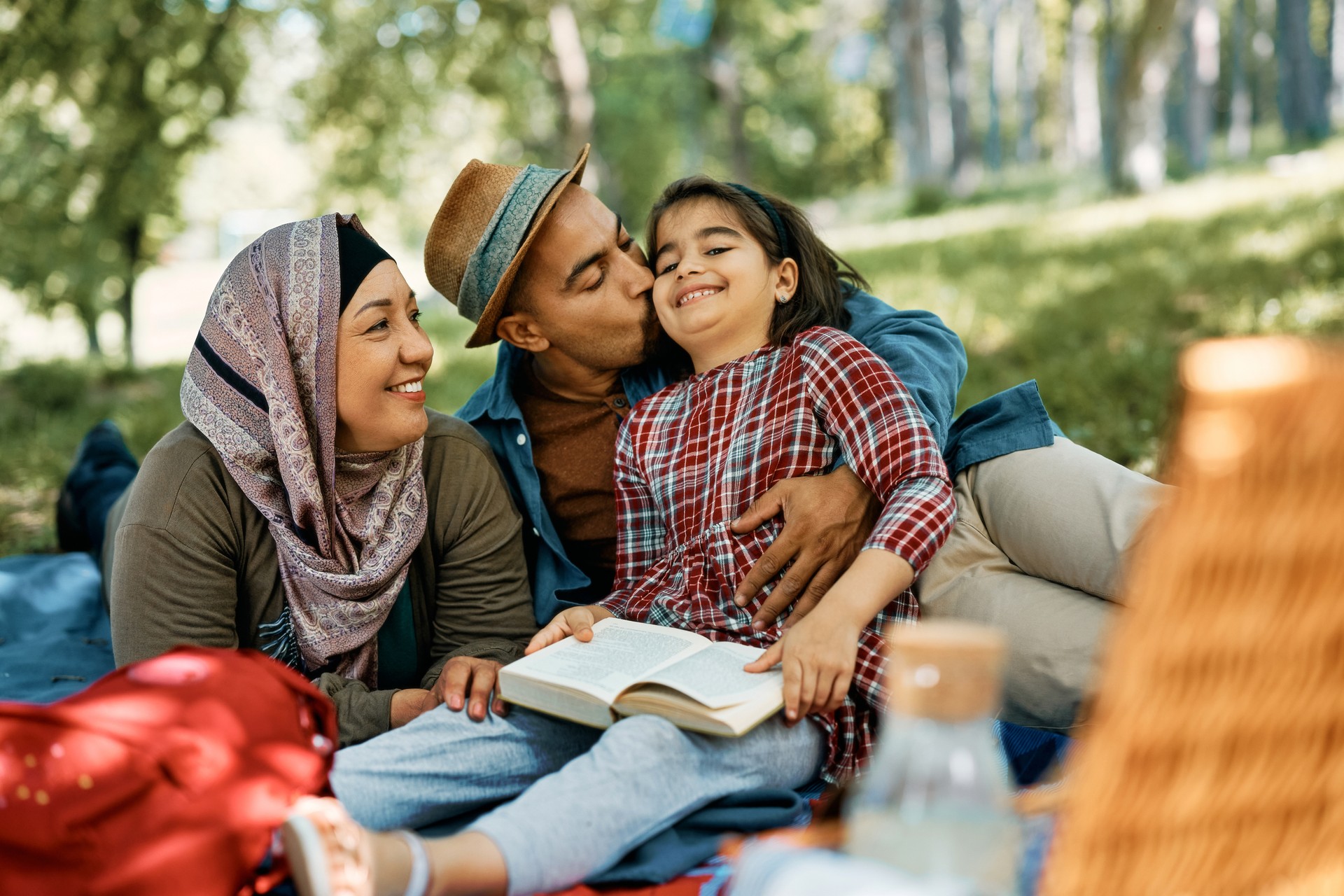 Loving Middle Eastern family enjoying in picnic day in nature. Loving Middle Eastern family enjoying in picnic day in nature.